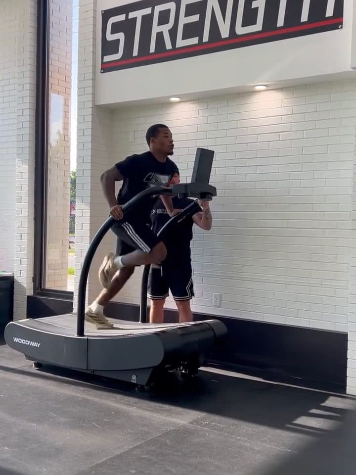 College football athlete sprinting on a curved treadmill at Batti Performance